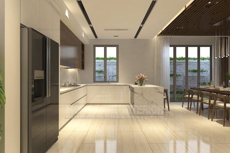 Màu trắng Acrylic của tủ bếp gỗ kết hợp với màu nâu đậm của gỗ Veneer óc chó mang lại vẻ đẹp hiện đại và tinh tế cho không gian bếp.